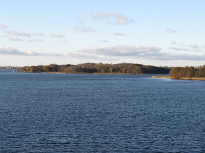 Isle Kaninchenwerder in the lake Schweriner See, Germany, seen from Reppin Castle on southern shore